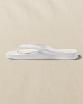 The left side view of the Southern Tide Archies Classic White Arch Support Flip Flop by Southern Tide - Classic White