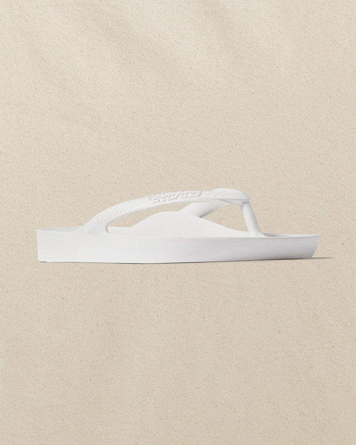 The right angle view of the Southern Tide Archies Classic White Arch Support Flip Flop by Southern Tide - Classic White