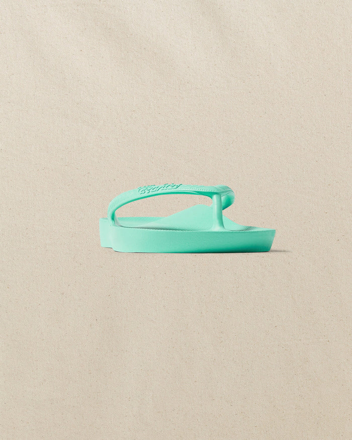 The front side view of the Southern Tide Archies Mint Arch Support Flip Flop by Southern Tide - Mint
