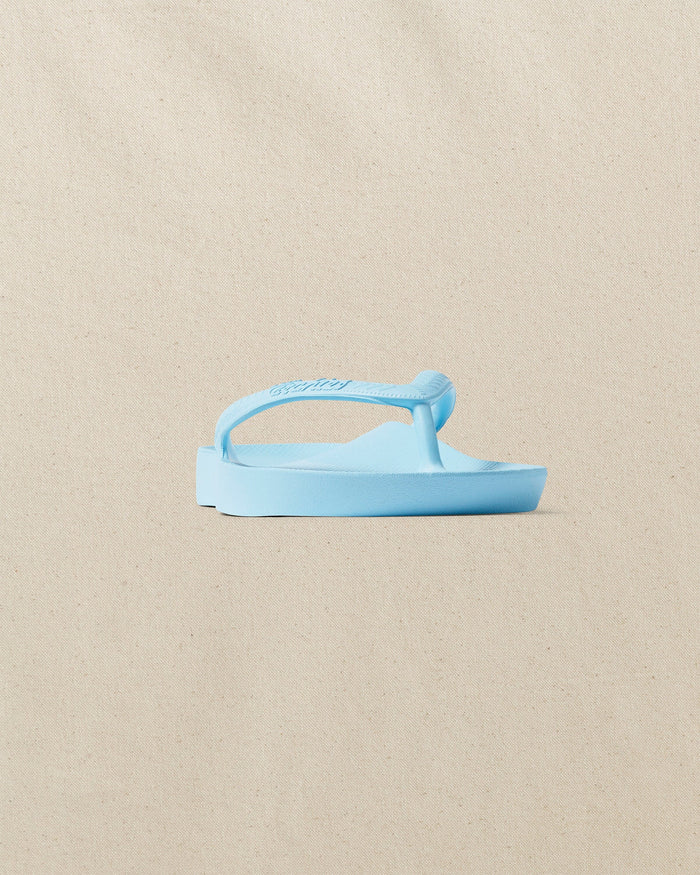 The front side view of the Southern Tide Archie's Sky Blue Arch Support Flip Flop by Southern Tide - Sky Blue