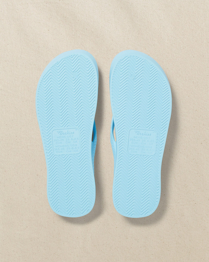 The bottom view of the Southern Tide Archie's Sky Blue Arch Support Flip Flop by Southern Tide - Sky Blue