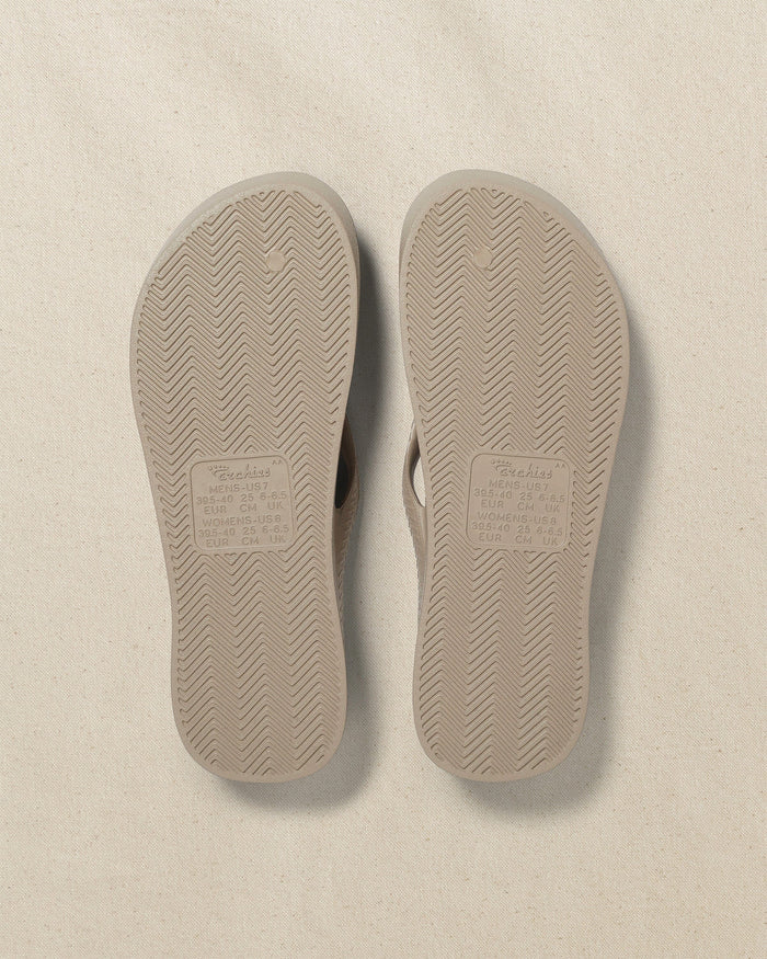 The bottom view of the Southern Tide Archie's Taupe Arch Support Flip Flop by Southern Tide - Taupe