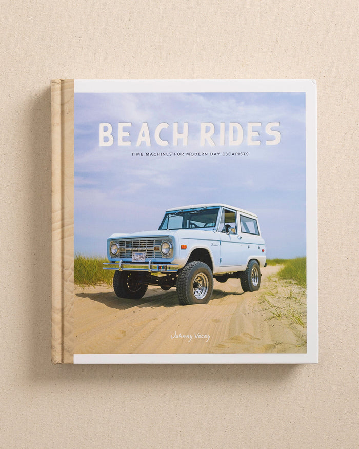 The front view of the Johnny Vacay Beach Rides Coffee Table Book at Southern Tide - White