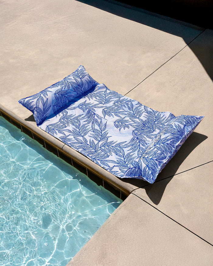 The front view of the Southern Tide Blue Palms Pool Float by Southern Tide - Blue Lolite