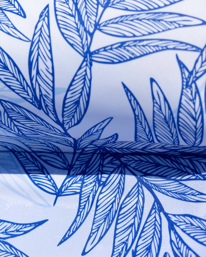 The detail view of the Southern Tide Blue Palms Pool Float by Southern Tide - Blue Lolite
