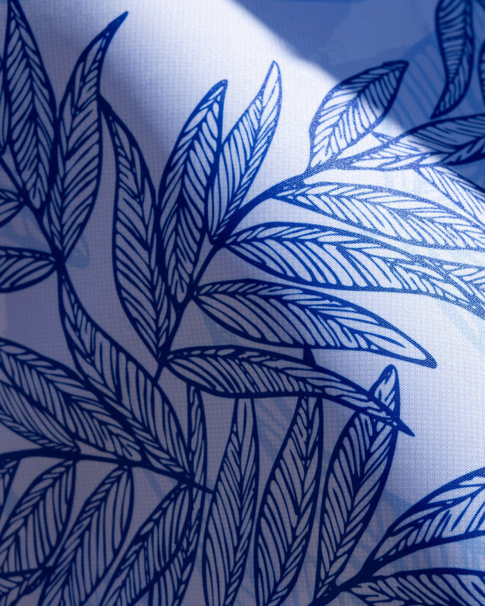 The detail view of the Southern Tide Blue Palms Pool Float by Southern Tide - Blue Lolite