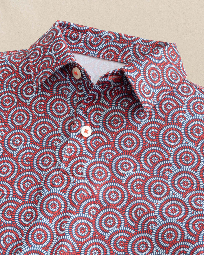 The detail view of the Southern Tide Boys Driver Firecracker Printed Performance Polo by Southern Tide - Channel Marker Red