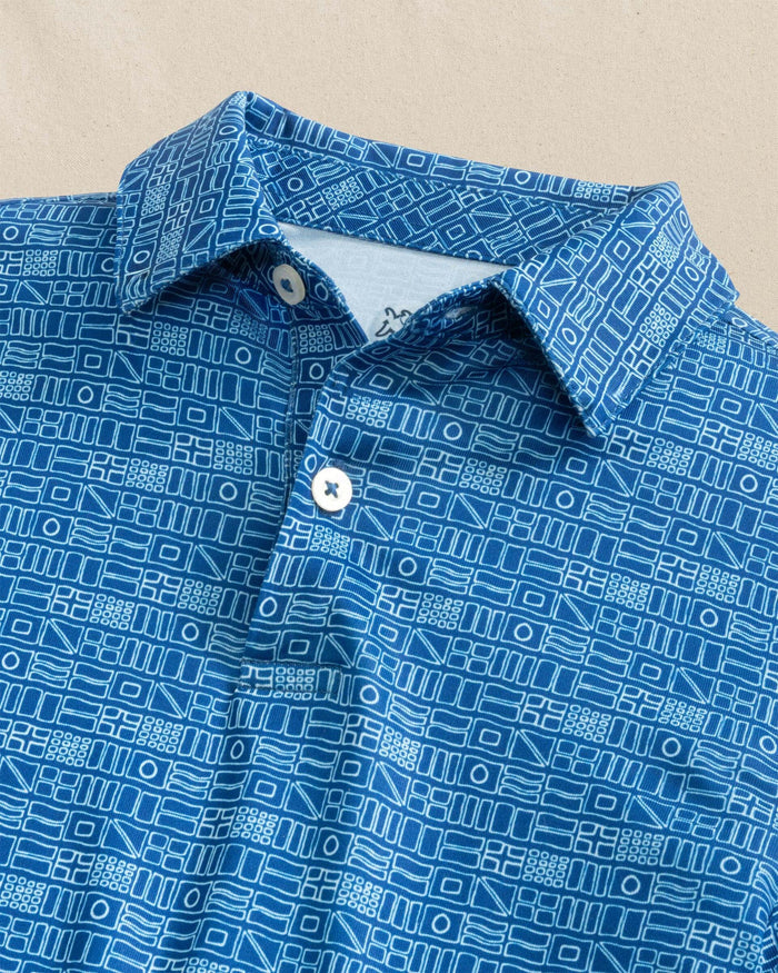 The detail view of the Southern Tide Boys Driver Nautical Flags Printed Performance Polo by Southern Tide - Nautical Blue