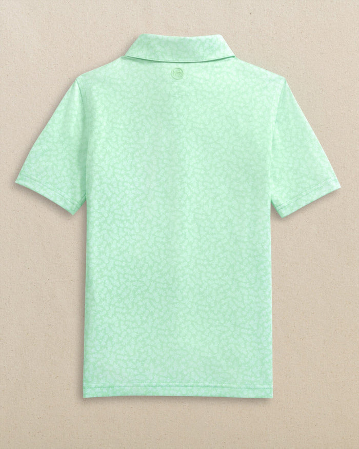 The back view of the Southern Tide Boys Driver Pineapple Parade Printed Performance Polo by Southern Tide - Green Ash