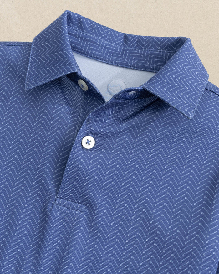 The front view of the Southern Tide Boys Driver Raise The Par Printed Performance Polo by Southern Tide - Nautical Blue