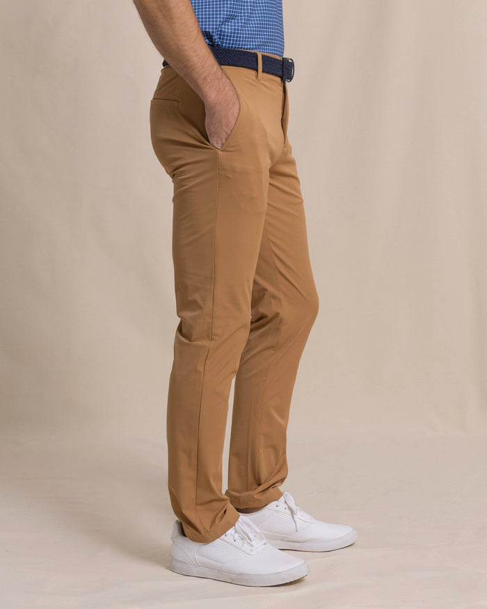 The side view of the Southern Tide brrr°®-die Performance Pant by Southern Tide - Hazelnut Khaki