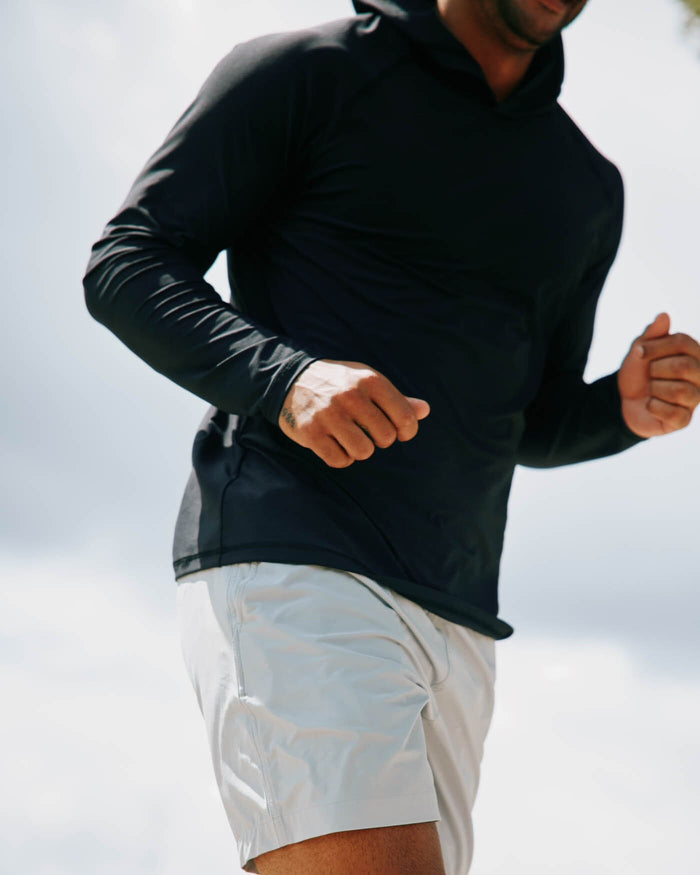 The front view of the Southern Tide brrr-illiant Performance Hoodie by Southern Tide - Caviar Black