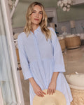 The lifestyle view of the Southern Tide Cara brrr Stripe Dress by Southern Tide - Cerulean
