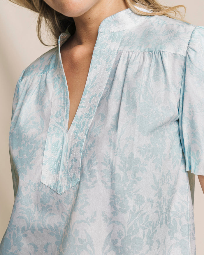 The detail view of the Southern Tide Cassia Bubble Sleeve Top by Southern Tide - Dewdrop Blue