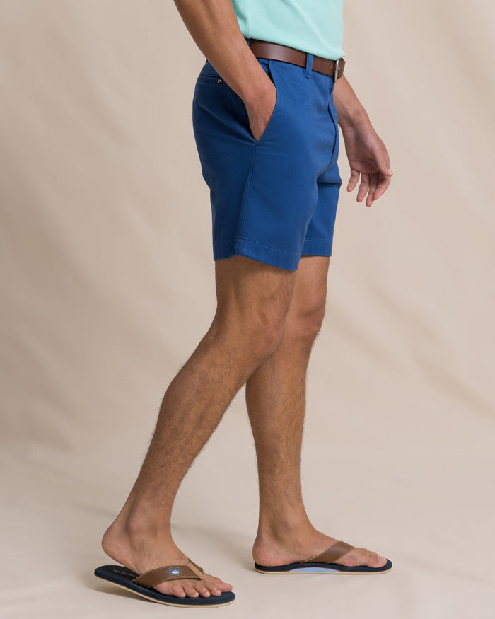 The side view of the Southern Tide Channel Marker 7" Stretch Chino Short by Southern Tide - Nautical Blue