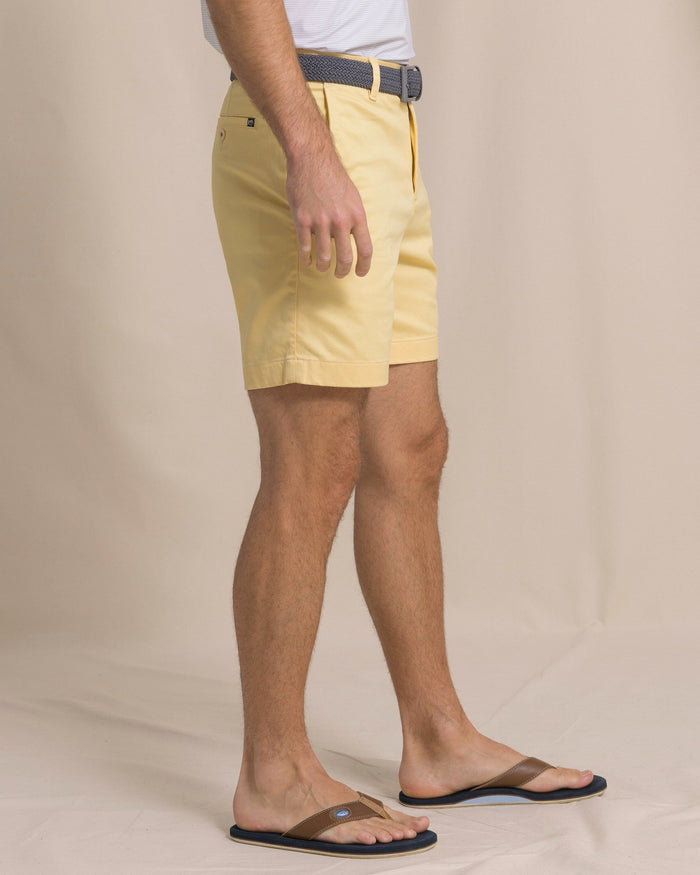 The side view of the Southern Tide Channel Marker 7" Stretch Chino Short by Southern Tide - Pineapple