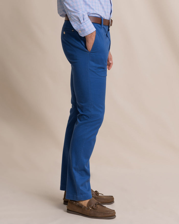 The side view of the Southern Tide Channel Marker Stretch Chino Pant by Southern Tide - Nautical Blue