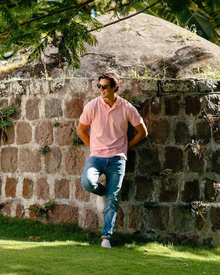 The lifestyle view of the Men's Blue Denim Charleston Denim Jeans by Southern Tide - Medium Wash