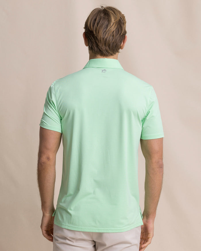 The back view of the Southern Tide Coastal Breeze® Heather Performance Polo by Southern Tide - Heather Green Ash