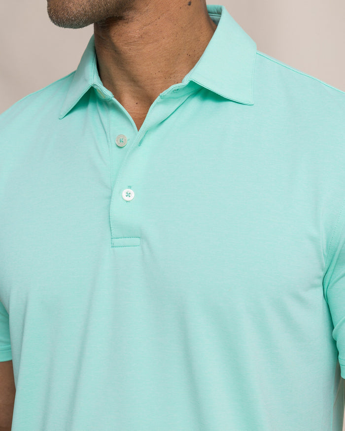 The detail view of the Southern Tide Coastal Breeze® Heather Performance Polo by Southern Tide - Heather Gulf Shores
