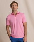 The front view of the Southern Tide Coastal Breeze® Heather Performance Polo by Southern Tide - Heather Sea Pink