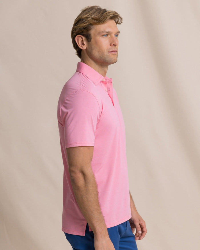 The side view of the Southern Tide Coastal Breeze® Heather Performance Polo by Southern Tide - Heather Sea Pink