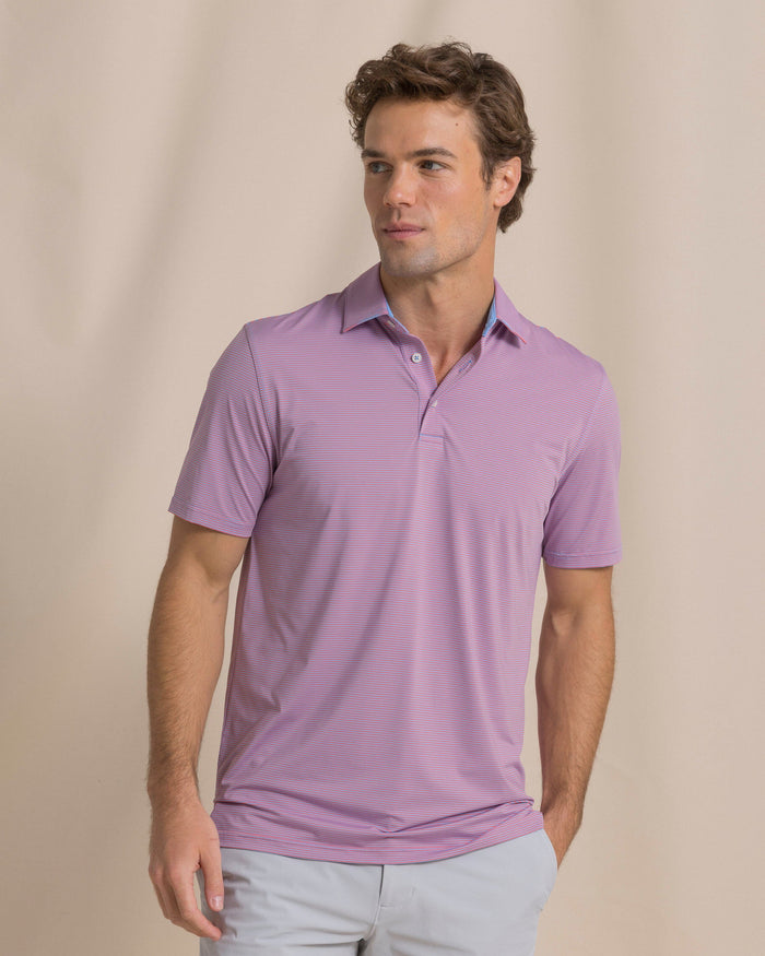 The front view of the Southern Tide Coastal Breeze® Meadowbrook Stripe Performance Polo by Southern Tide - Coral Beach