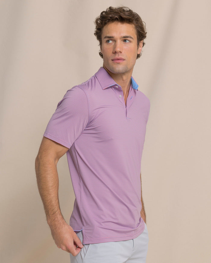 The side view of the Southern Tide Coastal Breeze® Meadowbrook Stripe Performance Polo by Southern Tide - Coral Beach
