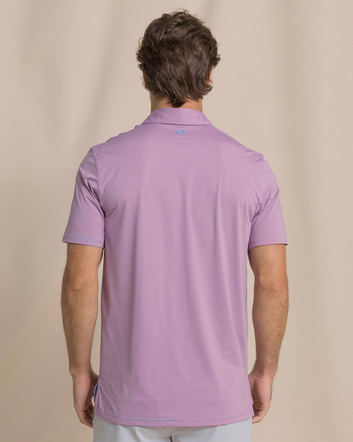 The back view of the Southern Tide Coastal Breeze® Meadowbrook Stripe Performance Polo by Southern Tide - Coral Beach