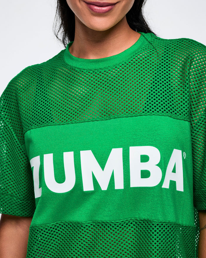 Close-up look at the Zumba mesh green top with Zumba in white letters on the center.