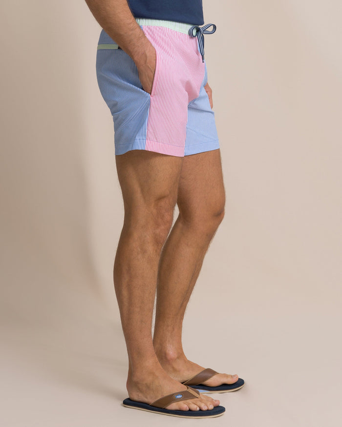 The side view of the Southern Tide Colorblock Seersucker Stripe Maritime Swim Trunk by Southern Tide - Blue Stream