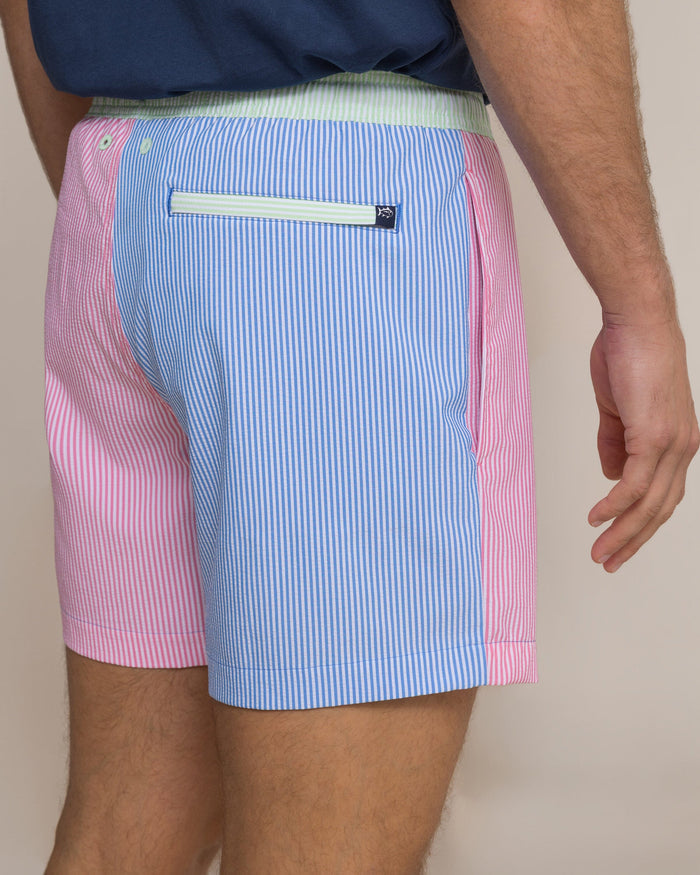 The detail view of the Southern Tide Colorblock Seersucker Stripe Maritime Swim Trunk by Southern Tide - Blue Stream