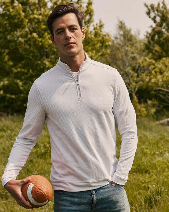 The lifestyle view of the Southern Tide Cruiser Micro-Stripe Heather Quarter Zip by Southern Tide - Heather Slate Grey