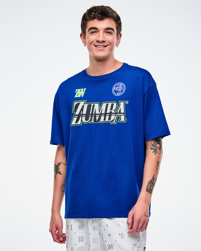 Male model wearing a blue Zumba t-shirt on a white background.