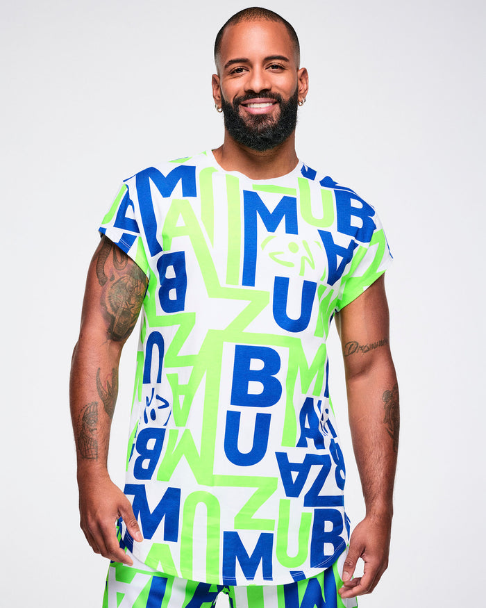 Male model wearing a colorful t-shirt with "ZUMBA" letter patterns on a plain background.
