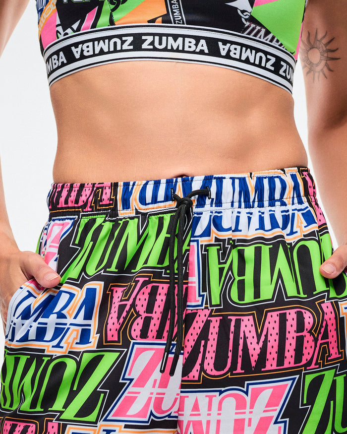 Close-up view of the elastic waistband and the black drawcords tied at the waist of a female model.