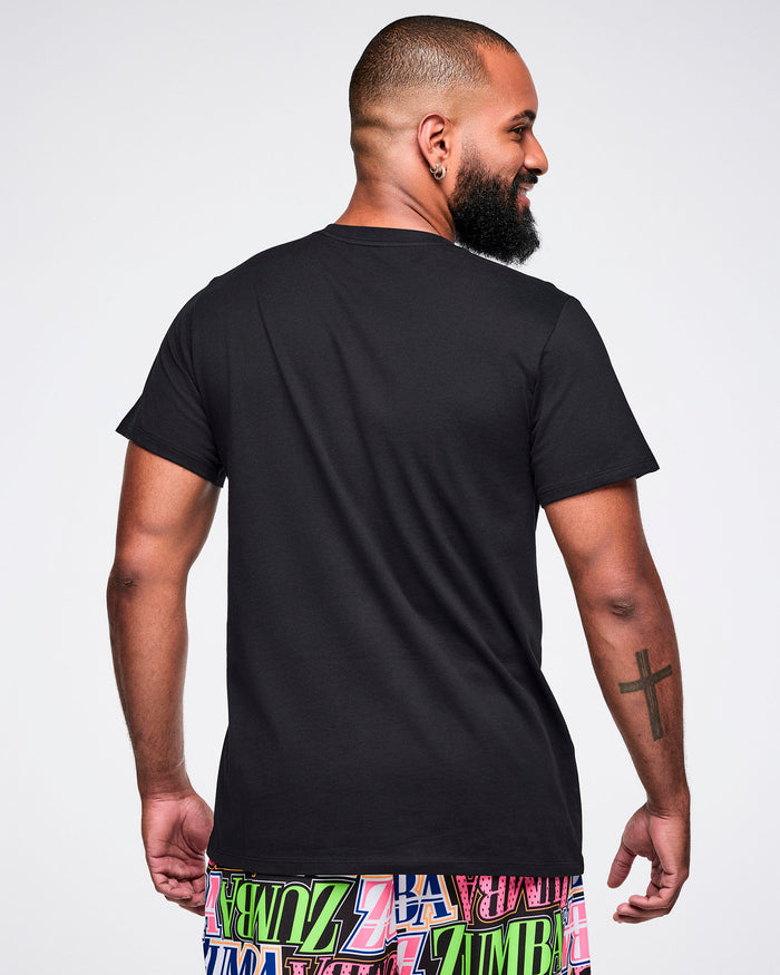Male model wearing a black Zumba tee on a white background.