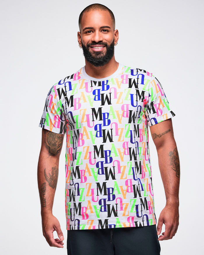Male model wearing a colorful 'ZUMBA' patterned t-shirt and black shorts.