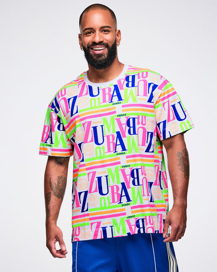 Male model wearing a colorful 'Zumba' t-shirt on a white background.