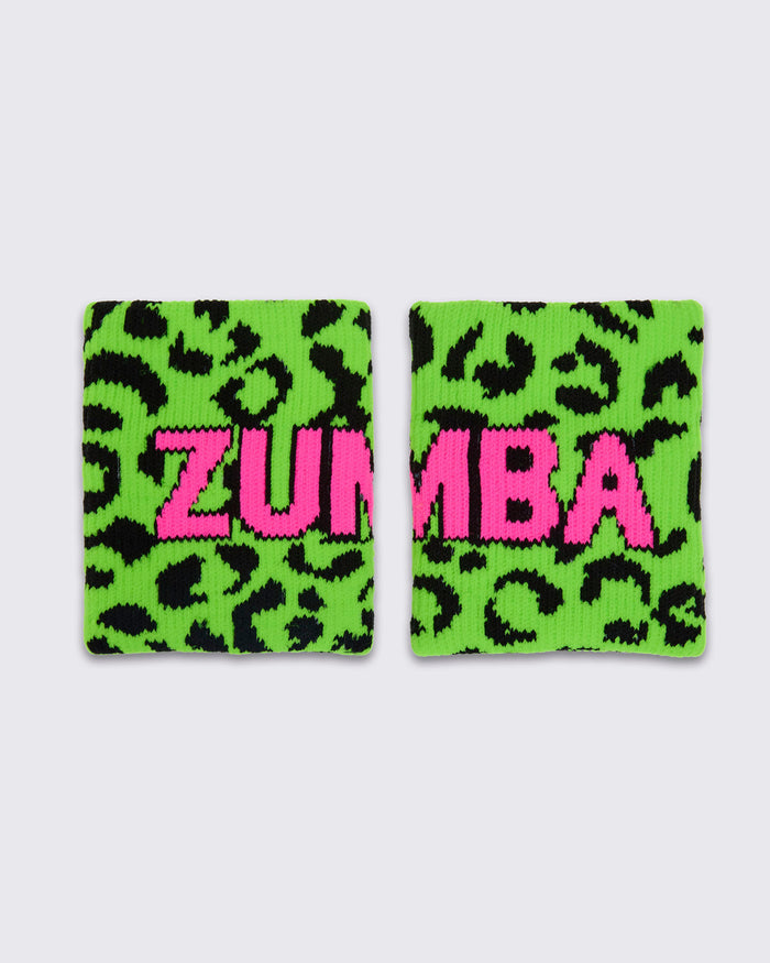 Two matching wristbands with a bright green and black leopard print background and the word 'ZUMBA' in large pink letters across the front, shown on a white background.