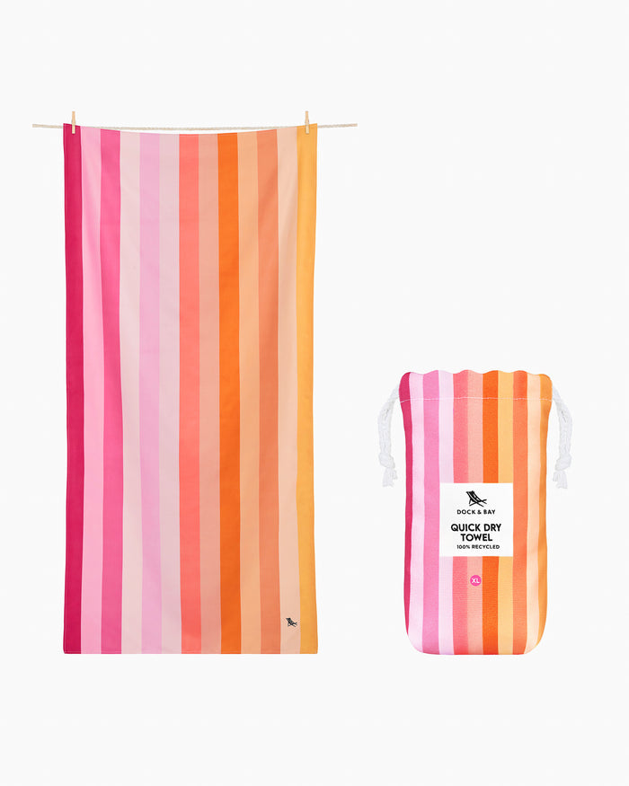 The side view of the Southern Tide Dock & Bay Quick Dry Beach Towel by Southern Tide - Miami Sorbet Pink