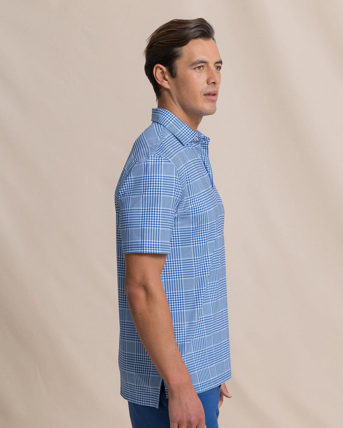 The side view of the Southern Tide Driver Coral Key Plaid Printed Polo by Southern Tide - Nautical Blue