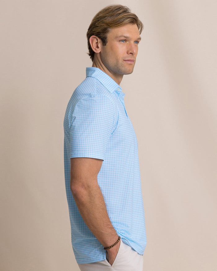 The side view of the Southern Tide Driver Dunes Edge Plaid Polo by Southern Tide - Tropical Breeze Blue