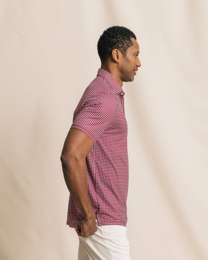 The side view of the Southern Tide Driver Dunes Edge Team Colors Plaid Polo by Southern Tide - Chianti