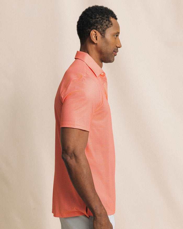 The side view of the Southern Tide Driver Getting Ziggy With It Printed Polo by Southern Tide - Orange Blossom