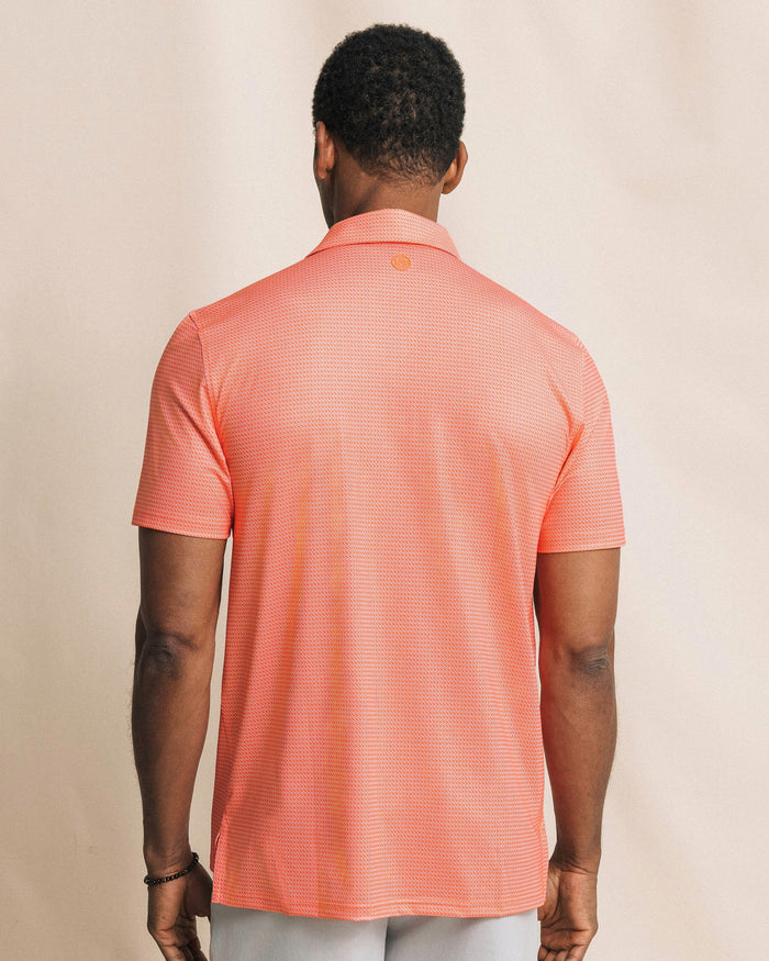 The back view of the Southern Tide Driver Getting Ziggy With It Printed Polo by Southern Tide - Orange Blossom