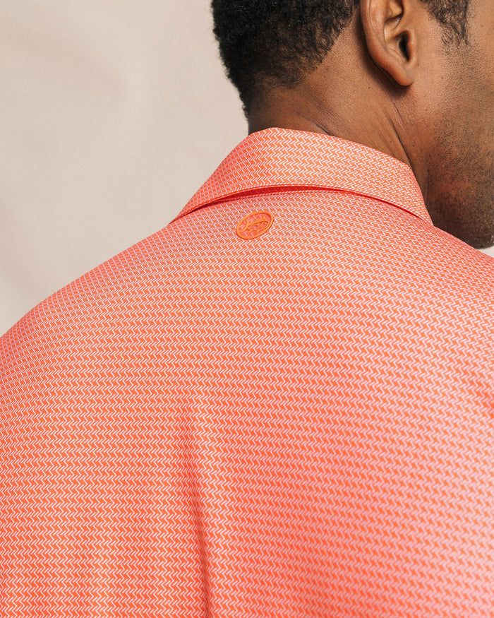 The detail view of the Southern Tide Driver Getting Ziggy With It Printed Polo by Southern Tide - Orange Blossom