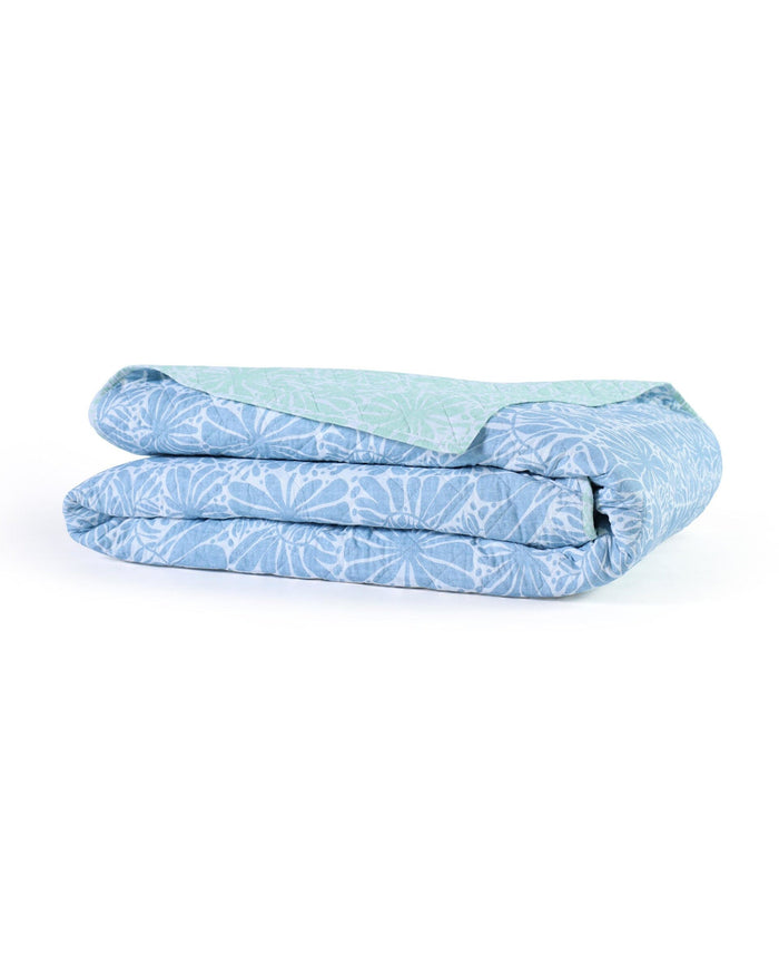 The front view of the Southern Tide Eldora Reversible Quilt by Southern Tide - Blue