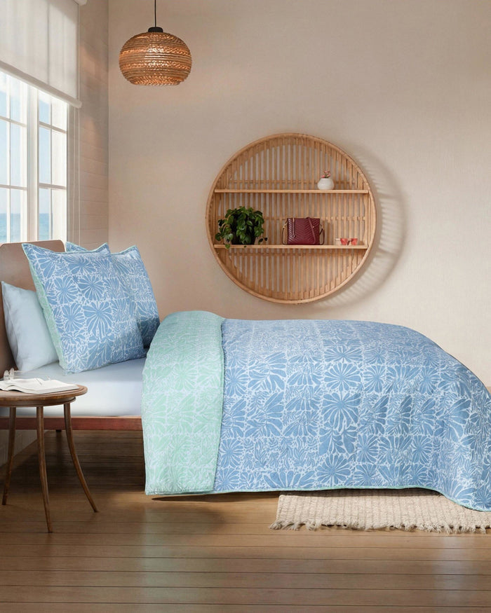 The side view of the Southern Tide Eldora Reversible Quilt by Southern Tide - Blue
