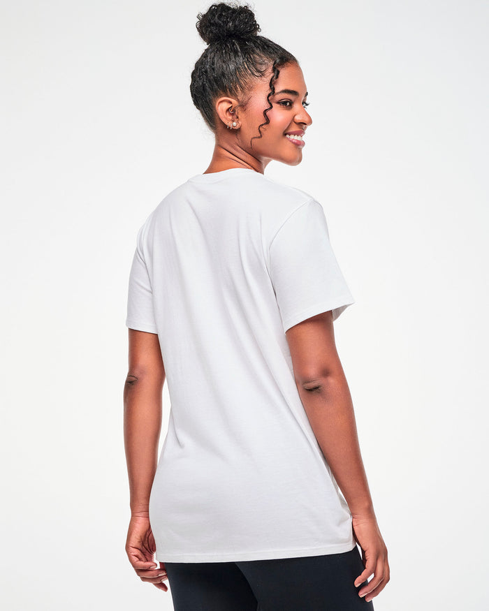 Shown from the back, female model wearing a white tee.